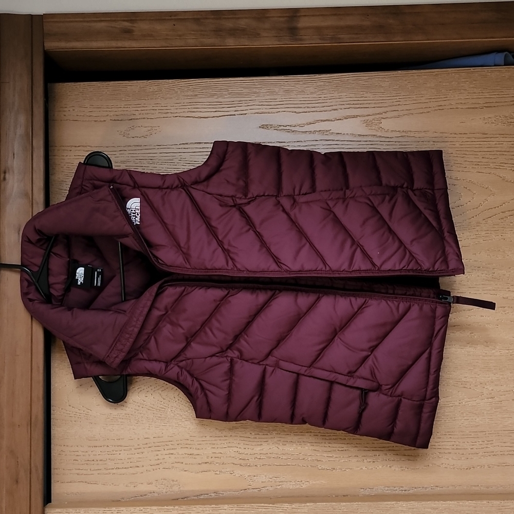 The North Face maroon vest. Size XS